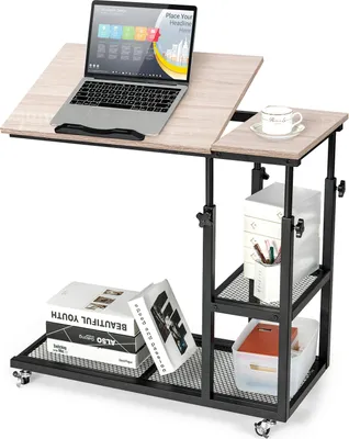 A laptop table with storage shelves, shown with a laptop, a cup, and books.