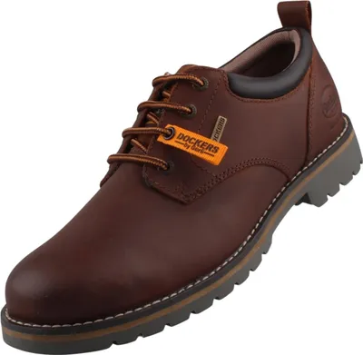 Auf dem Bild ist ein brauner Freizeitschuh zu sehen der von der Seite präsentiert wird. Der Schuh hat eine sportliche Silhouette und zeigt eine strukturierte Oberfläche sowie Schnürsenkel für einen sicheren Halt.