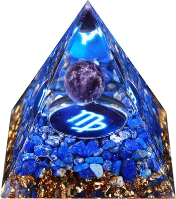 A pyramid-shaped object made of resin with embedded blue stones and a purple crystal ball on top.