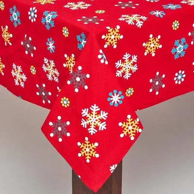 Image de HOMESCAPES Nappe flocons de neige rouges 100% coton, 138 x 228 cm
