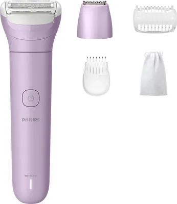 A collection of personal grooming tools, including a purple electric shaver and its attachments, laid out on a white background.