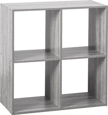 A four-compartment shelving unit with a gray oak effect.