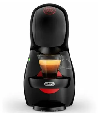 A black DeLonghi Nespresso Dolce Gusto coffee machine with a shot of espresso in a glass.