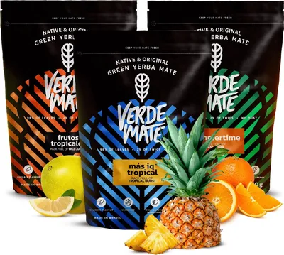 Three bags of Verde Mate yerba mate with tropical fruits in the foreground.