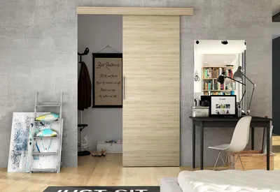 A modern room with a sliding door, desk, and shelving.