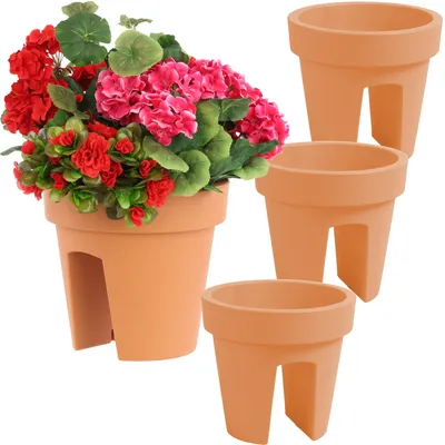 A set of terracotta balcony planters, one filled with red and pink flowers, and three empty planters.