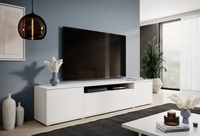 A modern living room with a TV stand and a large television.