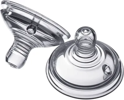 Two clear silicone baby bottle nipples are shown against a white background.