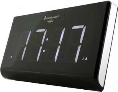 A digital alarm clock with a black body and white LED display.