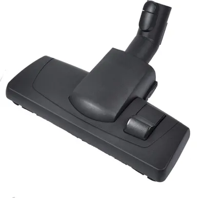 A black vacuum cleaner floor nozzle is shown on a white background.