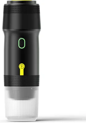 A black and white portable coffee maker with yellow and green accents, shown against a white background.