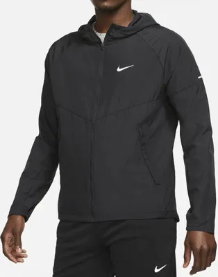 A man wearing a black Nike jacket.