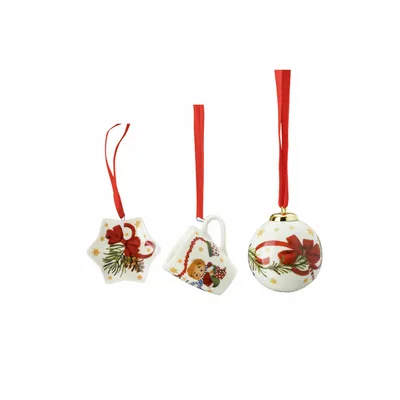 Three Christmas ornaments hanging on red ribbons against a white background.