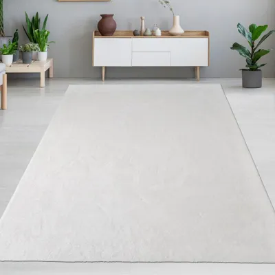Immagine prodotto di Tappeto in pelliccia di coniglio bianca dall'aspetto elegante e morbido, con un fine luccichio moderno Dimensioni - 160 x 230 cm