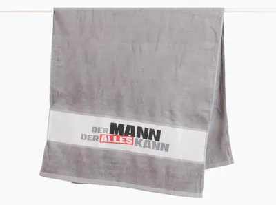 Produktbild von Badetuch aus Baumwolle Der Mann der alles kann grau schwarz 70x140cm
