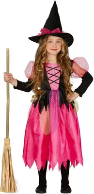 A young girl wearing a witch costume and holding a broom.