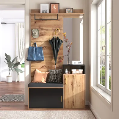 A hallway or entryway with a wooden furniture set including a bench, storage, mirror, and hooks.