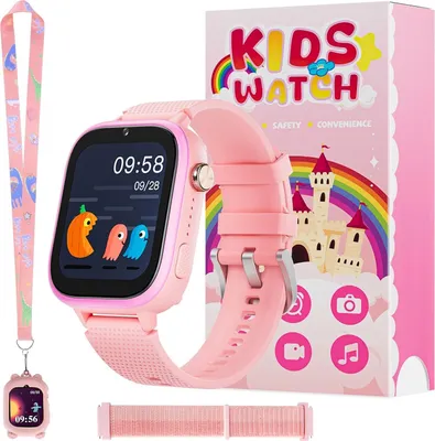 A pink smartwatch for kids is displayed next to its packaging, which features a castle and rainbow graphic. A lanyard with a charm is also included.