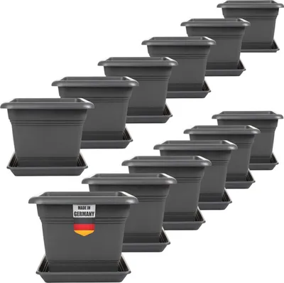 A collection of dark gray square planters with saucers arranged in a staggered, stepped pattern against a white background.