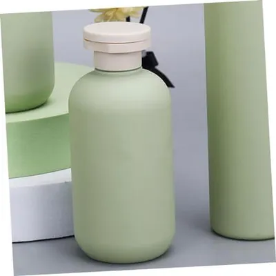 Produktbild von 4 nachfüllbare Shampooflaschen in Grün mit Deckel, Reisegröße für Kosmetik und Flüssigkeiten zu Hause und unterwegs