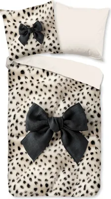 A duvet cover and pillowcase set with a leopard print and black bows, laid out flat.