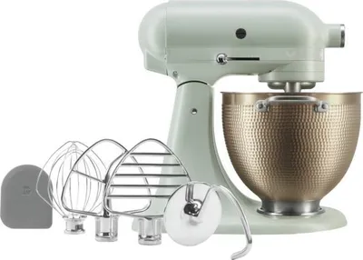 A KitchenAid stand mixer with various attachments and a textured bowl, displayed against a white background.