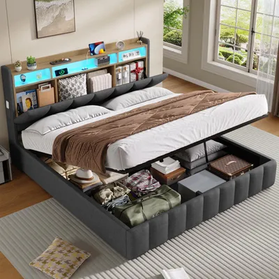 A bed with storage underneath, featuring LED lighting in the headboard and various items stored in the bed frame.