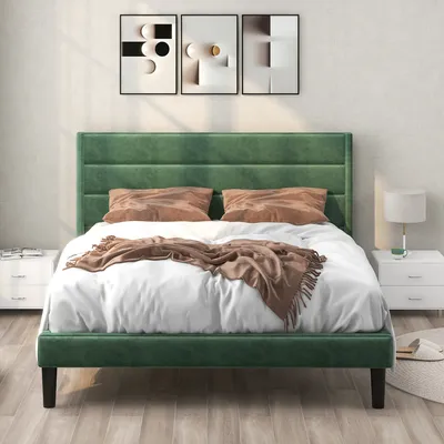 A bedroom scene with a green bed.