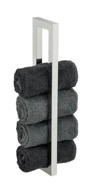 A towel rack with rolled towels.