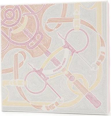 A close-up view of Hermès packaging with a horse tack design.