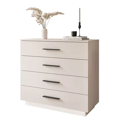 A beige dresser with black handles is shown against a white background. Decorative items are placed on top.