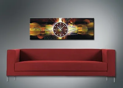 A red sofa is placed in front of a wall with a panoramic clock featuring gears and a clock face.