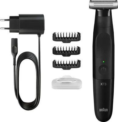 A black Braun Series X XT3100 beard trimmer with accessories, including a charging cable, power adapter, and three comb attachments, is displayed against a white background.
