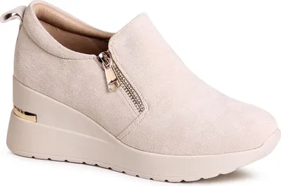 A single beige wedge shoe is shown against a white background.