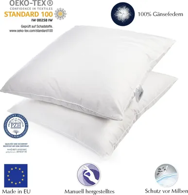 Two white pillows stacked on top of each other, with various certification logos and text overlays.