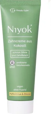 A green tube of toothpaste with white text and accents.
