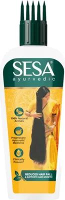 A bottle of Sesa Ayurvedic hair oil with a woman with long hair depicted on the packaging.