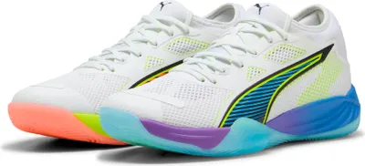 A pair of white Puma basketball shoes with colorful soles and accents.