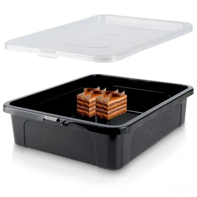 A black cake container with a clear lid, containing two slices of chocolate cake.