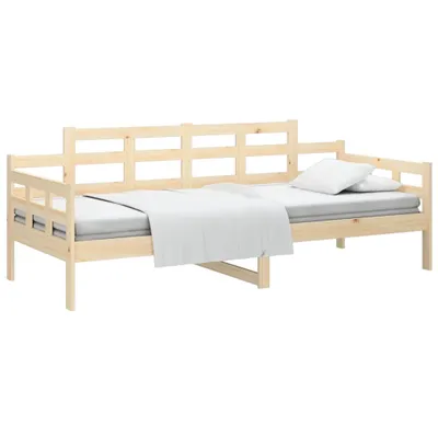 A wooden daybed with a mattress and white bedding, shown against a white background.