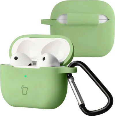 A light green silicone case for AirPods 3, with the case open showing the earbuds inside, and a separate lid shown in the background. A black carabiner is attached to the case.