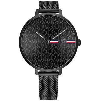 A close-up studio shot of a black Tommy Hilfiger analog watch.