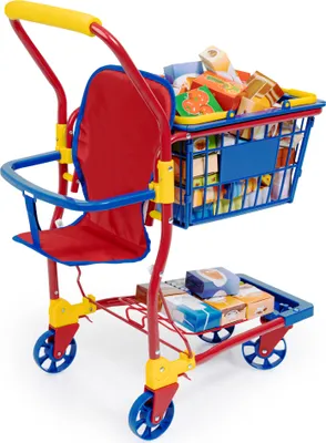A toy shopping cart filled with toy groceries and a doll seat.
