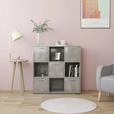 A modern living room scene with a gray modular bookshelf, a lamp, and a chair.