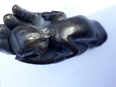 Produktbild von Kind in Hand,Höhe.ca.9,0cm, anthrazit bis schwarz