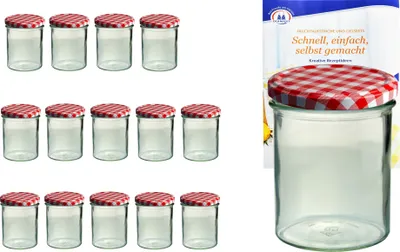 A set of glass jars with red and white checkered lids, and a recipe book in the background.