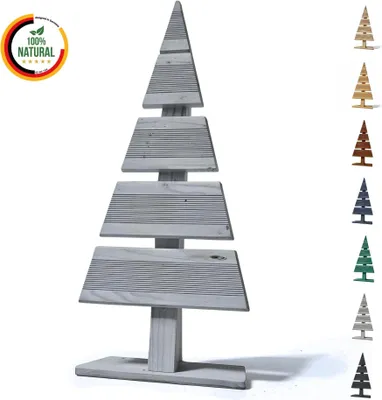 A grey wooden Christmas tree decoration, displayed with other colored versions on the right and a "100% Natural" badge on the left.