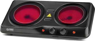 A black electric double hot plate with red heating elements.