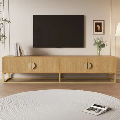 A modern living room scene featuring a TV stand and a television.