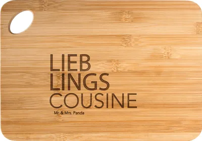 Produktbild von Mr. & Mrs. Panda Holzbrett Cousine - Transparent - Geschenk, Kusine, Geschenkidee, Frühstücksbrett, Cousin, Tochter von Tante, Brett, Spruch, Schneidebrett, Kousine